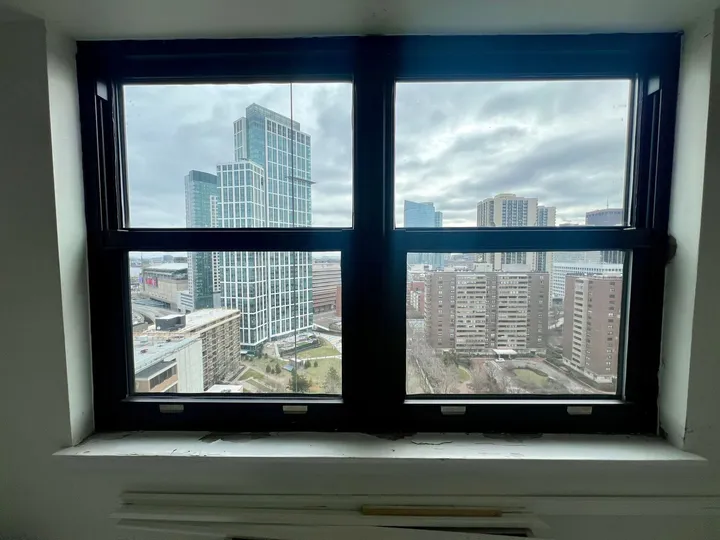 Single hung aluminum window in dark bronze