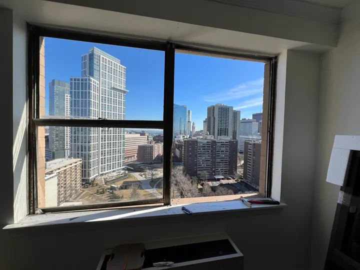 Window replacement with a city skyline view