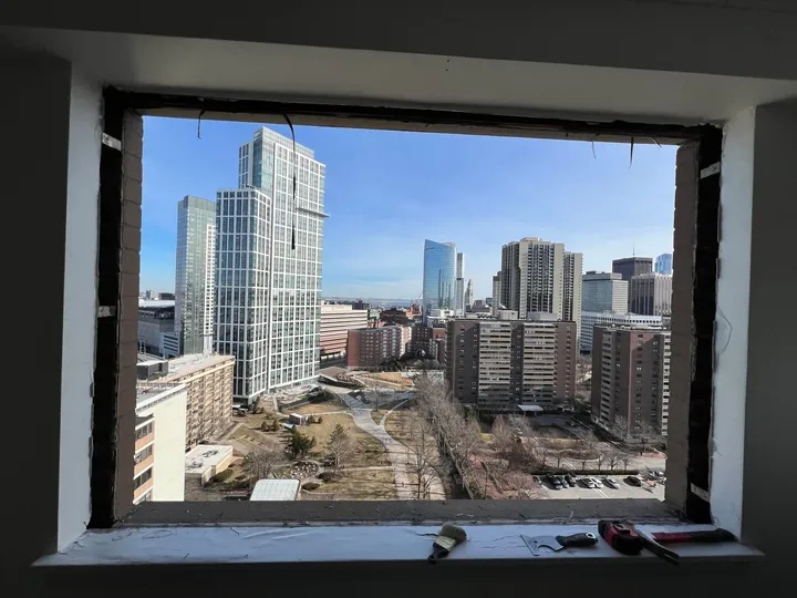 Window opening with a city skyline view