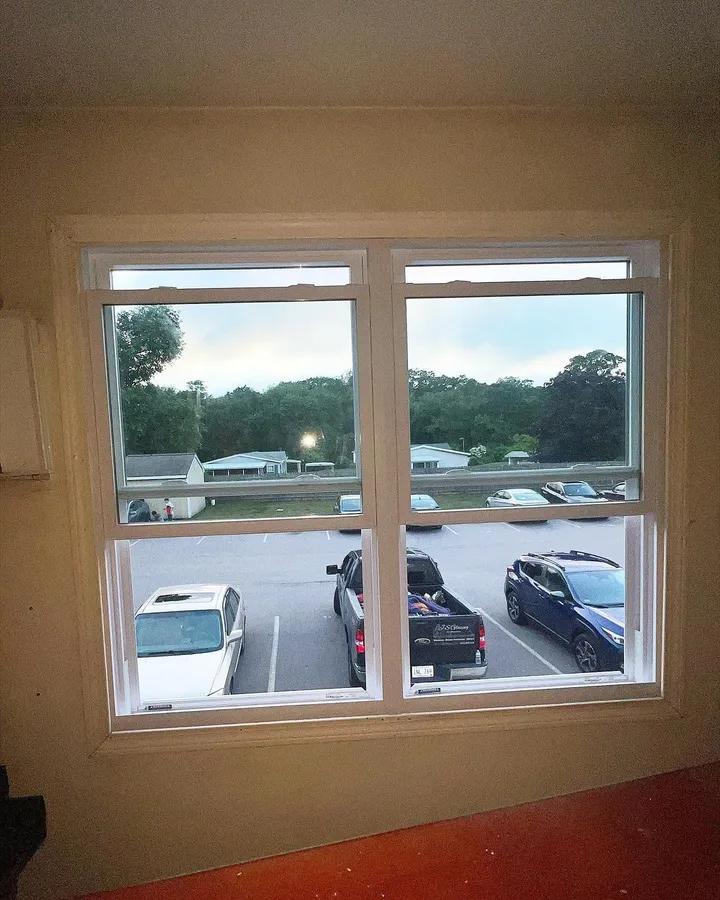 Commercial windows overlooking a parking lot