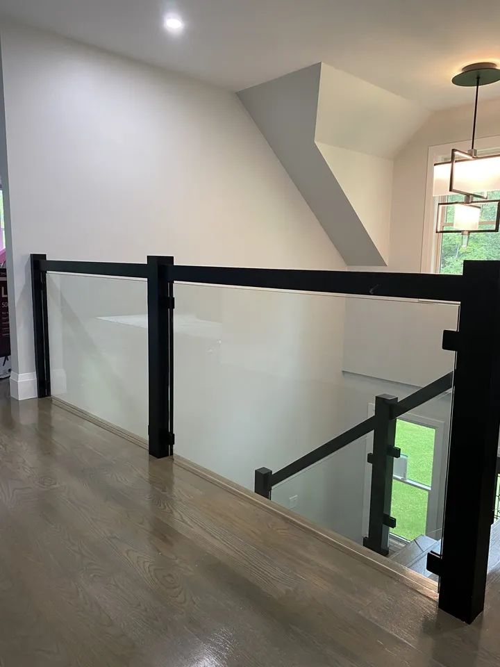 Glass railing panels fitted to a black frame
