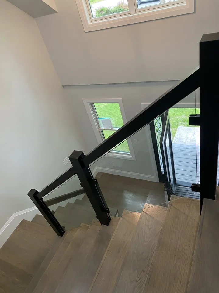 Glass stair railing installed along a staircase