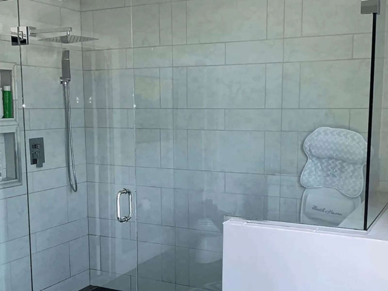 Custom frameless glass shower enclosure installed by J.S Glazing LLC