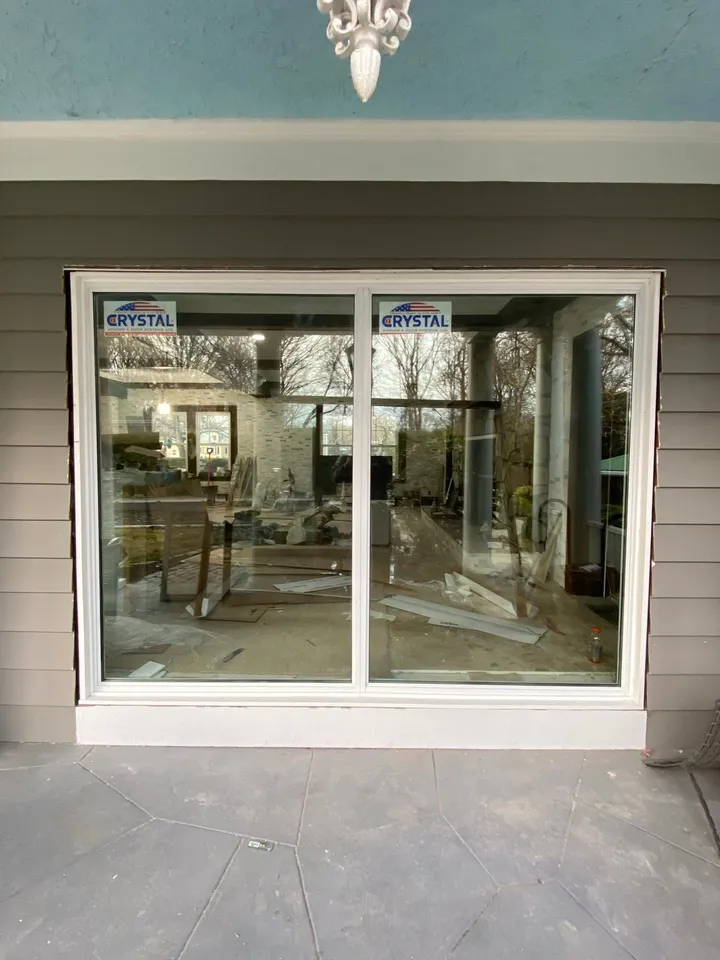 New sliding glass patio door installed in a home