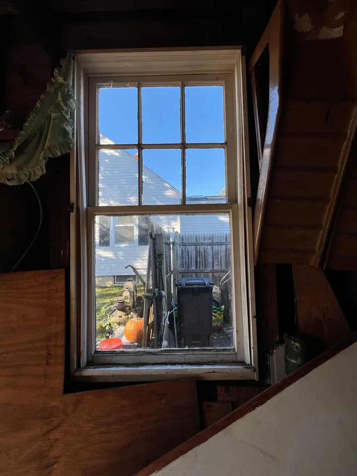 Interior view of an old wood window before replacement